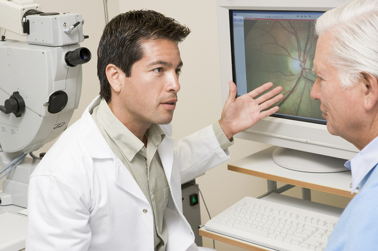 bigstock Doctor Explaining Eye Exam Res 13894100